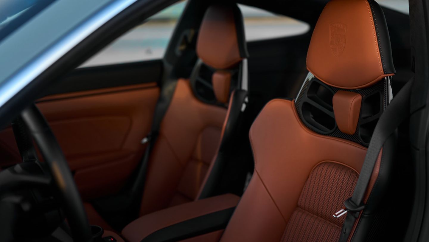 The interior features Full Bucket Seats with cloth seat centers in Classic Cognac with black pinstripes